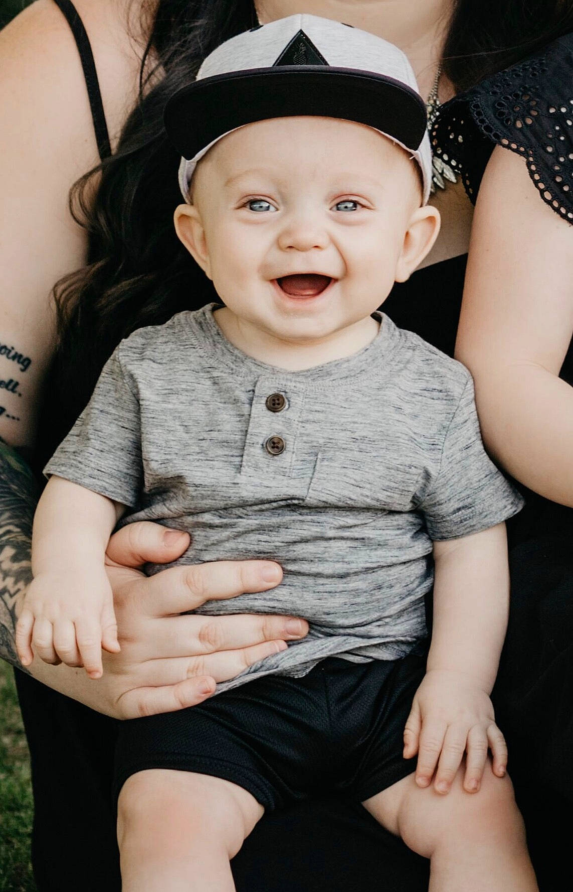 Abel is registered to the contest to win money with this photo: arm, baby, cheek, child, child_model, fashion_accessory, finger, gesture, hand, headgear, headwear, leg, lip, nail, person, photo_shoot, photograph, photography, sitting, skin