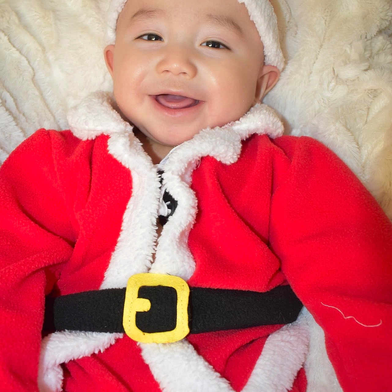 Tony Iii is registered to the contest to win money with this photo: accessories, baby, cap, clothing, coat, costume, face, happy, hat, head, hood, jacket, knitwear, laughing, lifejacket, person, photography, portrait, smile, sweater