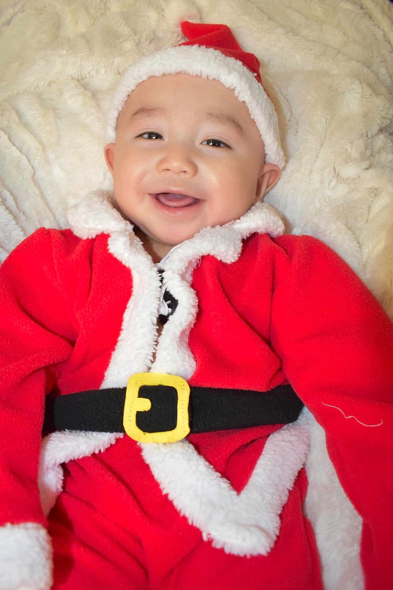 Tony Iii is registered to the contest to win money with this photo: accessories, baby, cap, clothing, coat, costume, face, happy, hat, head, hood, jacket, knitwear, laughing, lifejacket, person, photography, portrait, smile, sweater