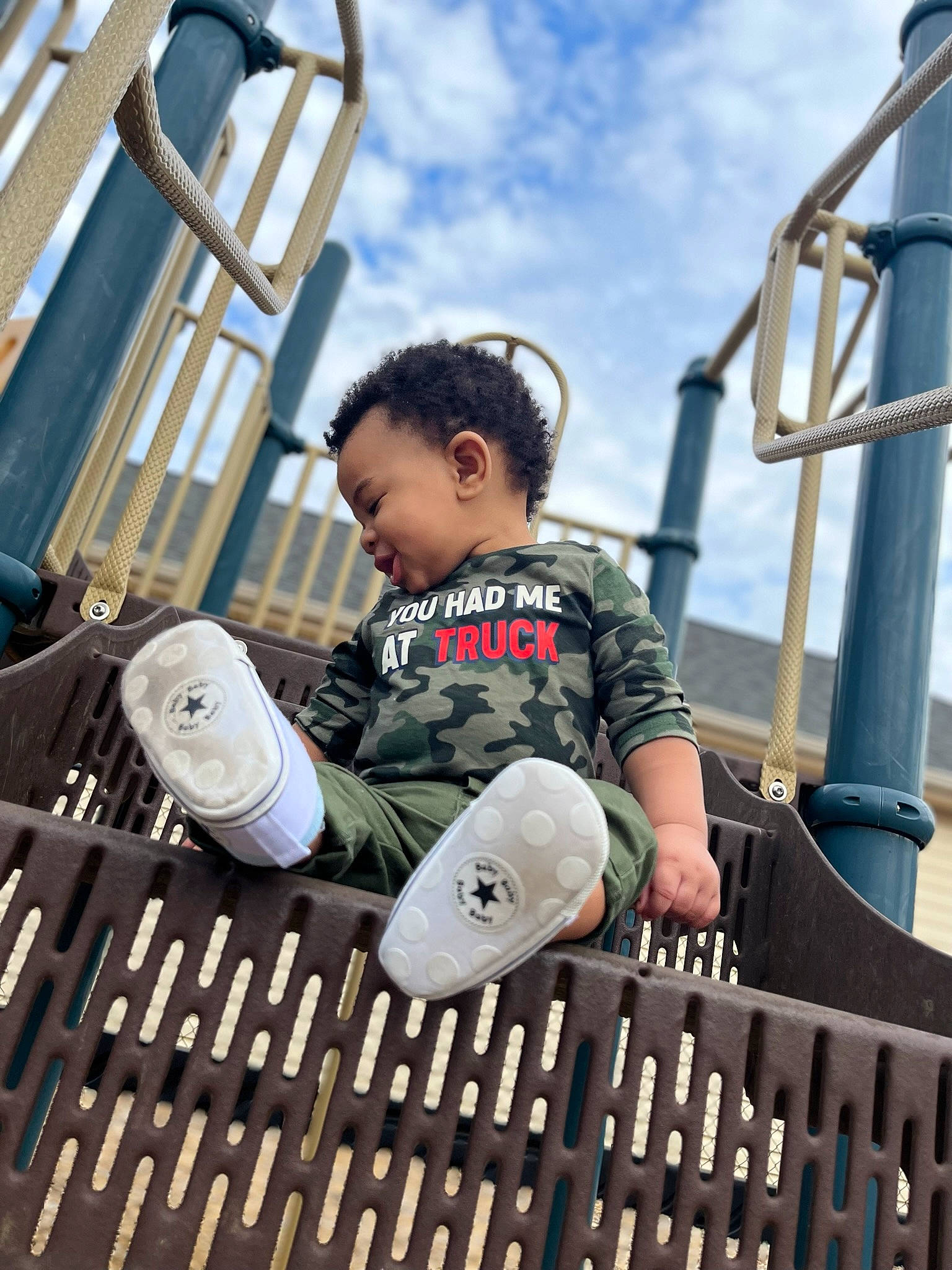 Ahmir joined the competition — help win amazing prizes! child, city, cloud, engineering, fun, happy, leisure, nonbuilding_structure, outdoor_play_equipment, person, personal_protective_equipment, playground, recreation, sitting, sky, swing, t_shirt, toddler, travel, vacation