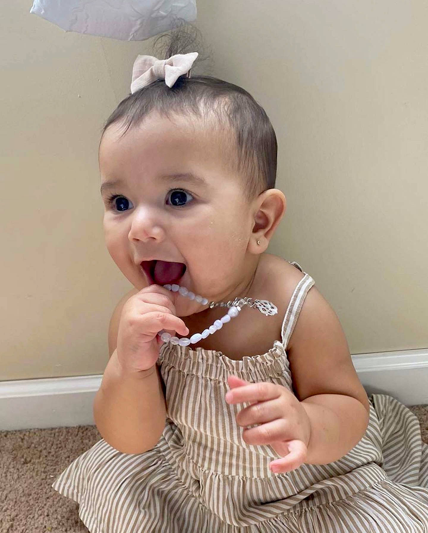 Addilyn joined the competition — help win amazing prizes! baby, baby_toddler_clothing, dress, ear, eye, eyelash, finger, gesture, hand, happy, head, iris, joint, leg, neck, person, pink, skin, sleeve, surprise