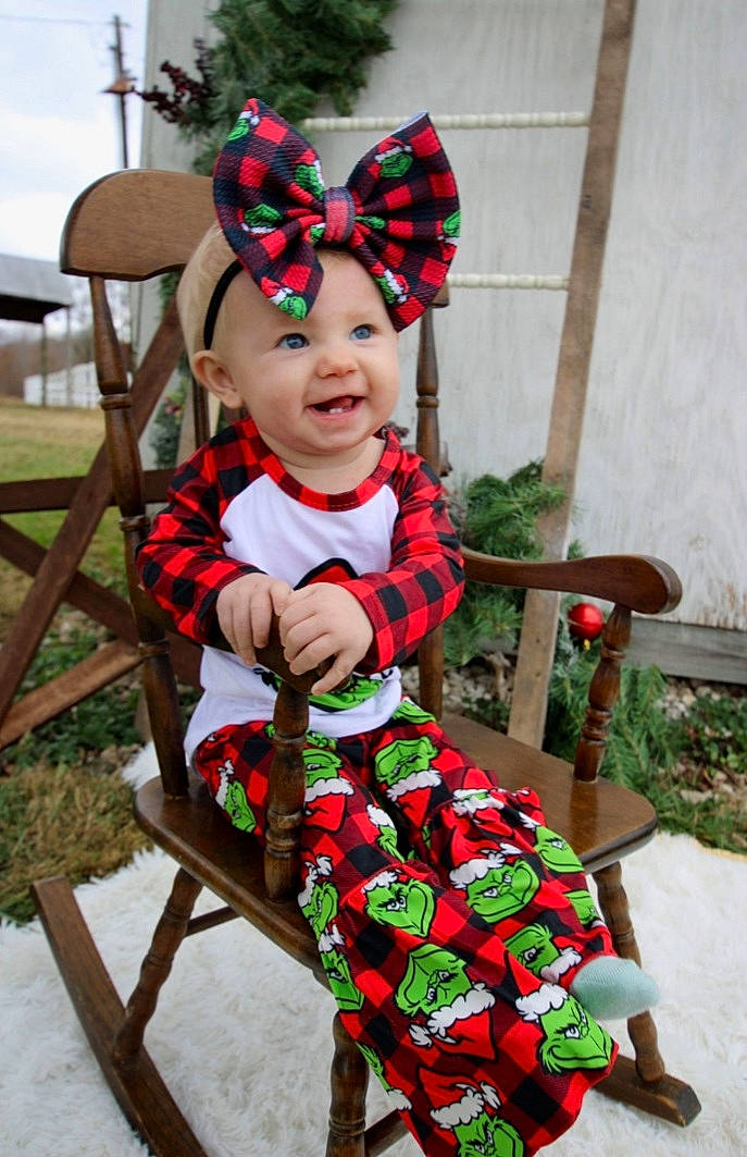 Sidney is registered to the contest to win money with this photo: baby_products, baby_toddler_clothing, child, costume, fawn, fictional_character, flower, headwear, person, plant, red, toddler