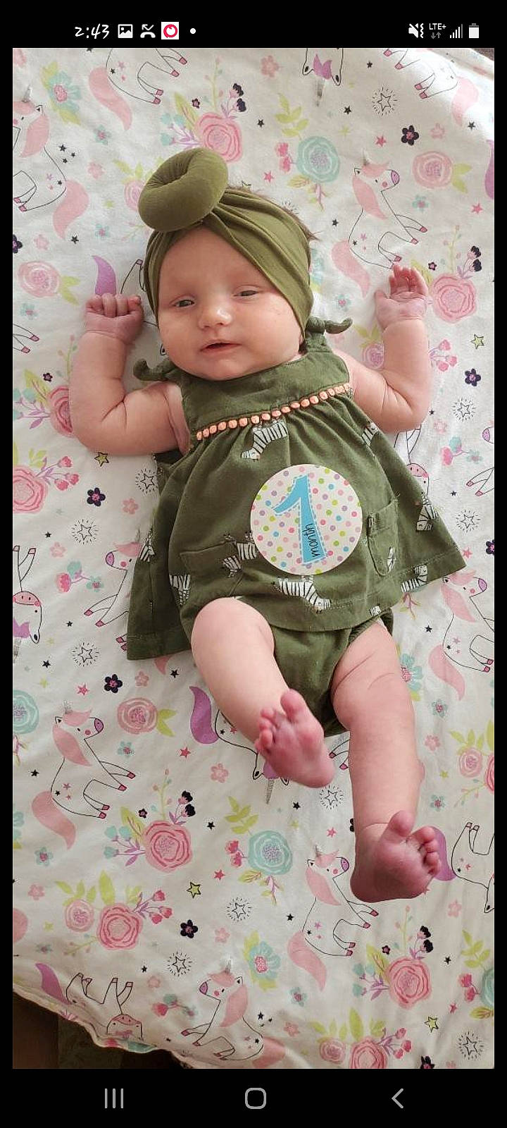 Libby is registered to the contest to win money with this photo: baby, baby_toddler_clothing, beauty, cap, cheek, child, dress, facial_expression, finger, head, headwear, pattern, people, person, photograph, pink, product, skin, sleeve, textile