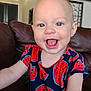 Rylee joined the competition — help win amazing prizes! baby, child, smiling, blue_eyes, watermelon_pattern, shirt, arm, couch, indoor, living_room, happy, face, person, toddler, short_sleeves, skin, expression, closeup, home, furniture