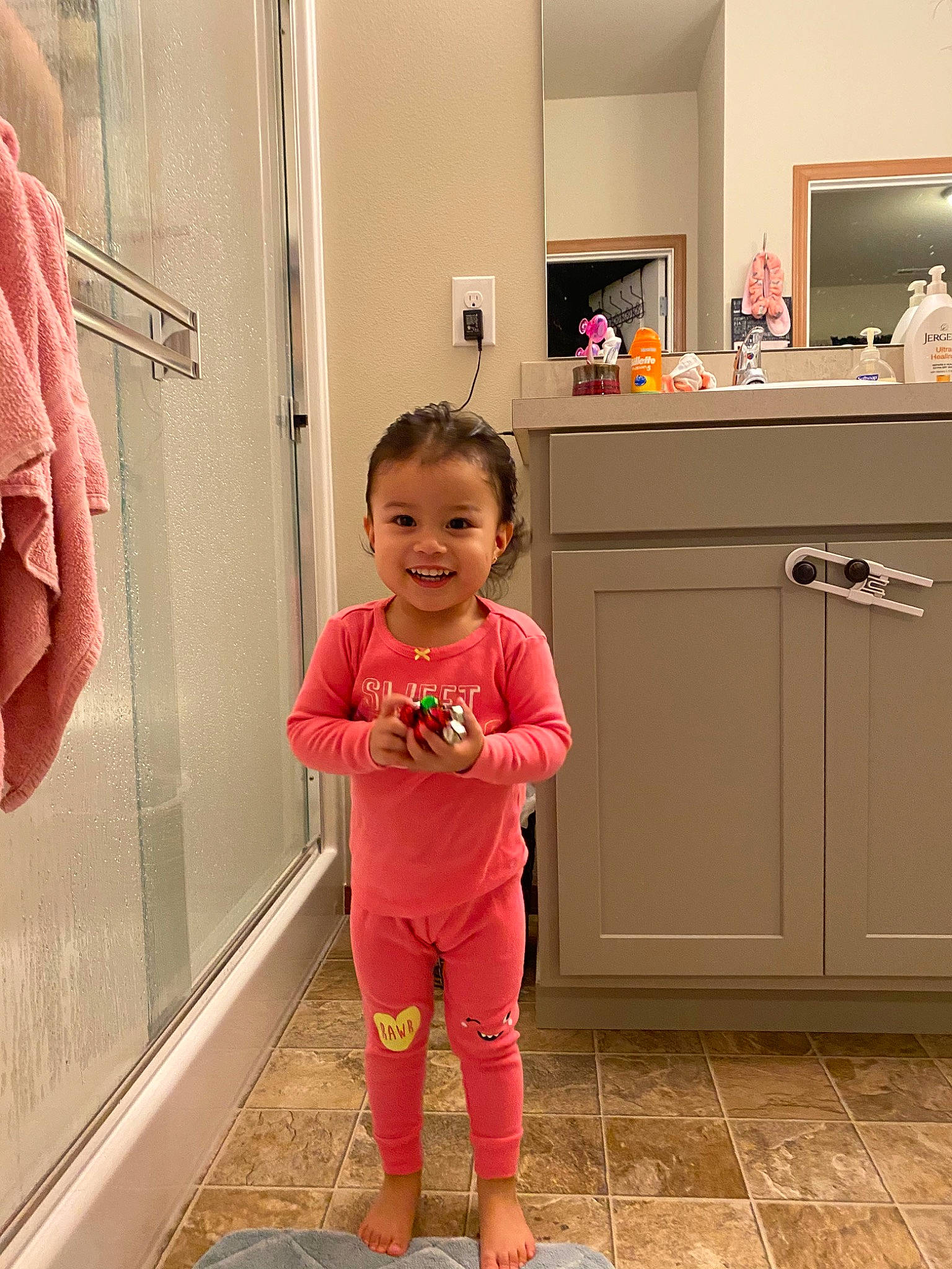 Kenzley joined the competition — help win amazing prizes! baby, bathroom, child, floor, flooring, joy, leg, pajamas, person, pink, product, room, skin, standing, toddler