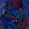 baby, newborn, sleeping, blanket, pacifier, mickey_mouse, infant, bed, cozy, nighttime, soft_lighting, cute, child, person, indoors, resting, comfort, sleep, timestamp, blue_tone