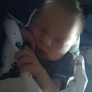 Anakin is registered to the contest to win money with this photo: baby, sleeping, blanket, infant, cozy, peaceful, child, soft_light, indoor, wrapped, calm, cute, human, portrait, newborn, hand, resting, comfort, toddler, warm