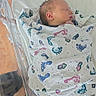 Anakin joined the competition — help win amazing prizes! newborn, baby, blanket, hospital, bassinet, sleeping, pacifier, infant, wrapped, footprint_pattern, plastic, bed, resting, peaceful, young_child, person, indoors, healthcare, maternity, soft_lighting