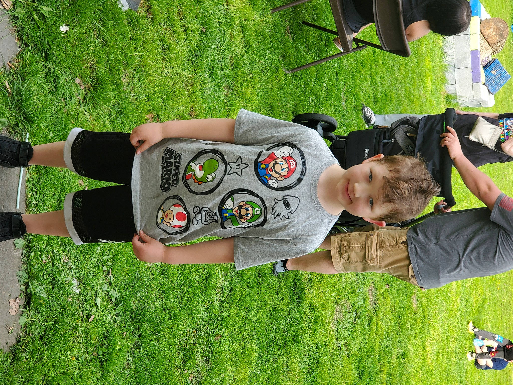 Mayson joined the competition — help win amazing prizes! bottle, child, elbow, fun, games, grass, grass_family, grassland, green, happy, human_leg, joy, lawn, leisure, people_in_nature, person, plant, play, recreation, t_shirt