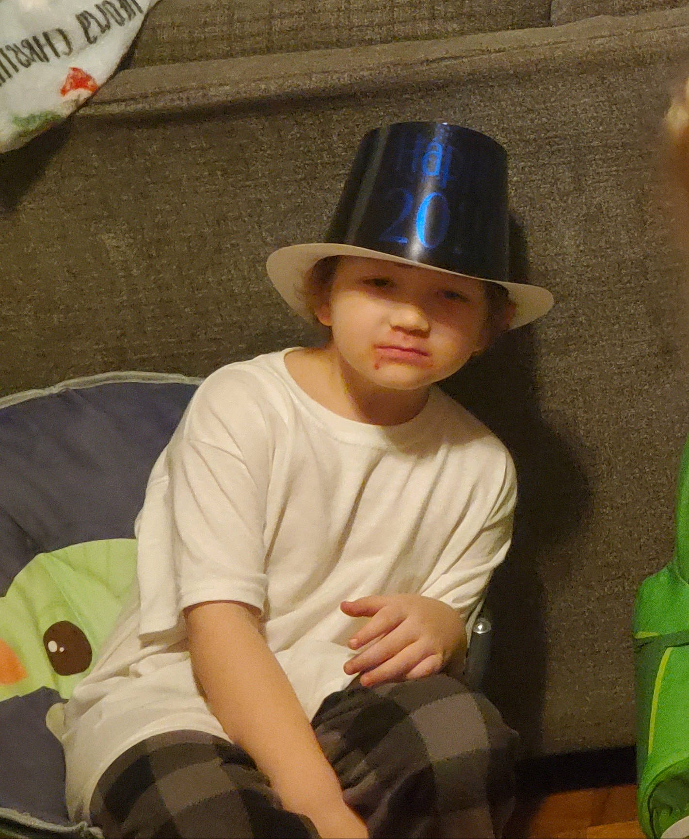 Mayson joined the competition — help win amazing prizes! baby_toddler_clothing, child, cool, costume_hat, fashion_accessory, fun, happy, hat, headgear, headwear, human_leg, pattern, person, plaid, shorts, sitting, sleeve, sun_hat, tartan, thigh