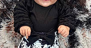 Clairann joined the competition — help win amazing prizes! adorable, baby, black_clothing, child, closeup, cow_print_pants, cute, fluffy_rug, four_months, happy, indoor, infant, lying_down, milestone, person, pigtails, portrait, smiling, wooden_sign, young_child