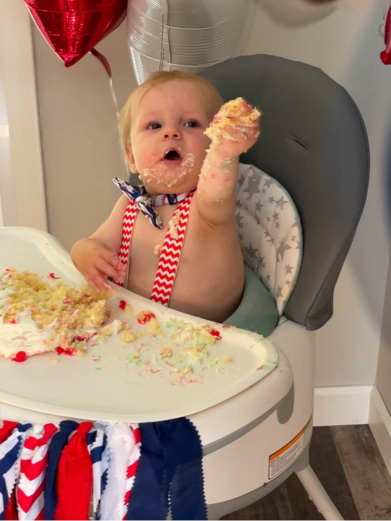Van is registered to the contest to win money with this photo: baby, baby_toddler_clothing, chair, child, event, food, happy, icing, lamp, pattern, person, pink, plate, product, room, sitting, sweetness, table, tie, toddler