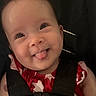 Alice Ophelia joined the competition — help win amazing prizes! baby, child, car_seat, red_clothing, straps, smiling, tongue_out, cute, infant, seatbelt, person, face, happy, young_child, indoors, head, portrait, playful, childrens_clothing, seat