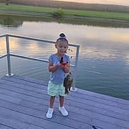 Kai'Lani Garnett joined the competition — help win amazing prizes! activity, child, clothing, dock, fish, fishing_rod, grass, happy, lake, leisure, nature, outdoor, person, reflection, shoes, sky, summer, sunset, tree, water
