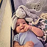 Romeo joined the competition — help win amazing prizes! baby, infant, stuffed_animal, plush_toy, bunny, hat, smile, hand, blanket, playpen, child, cute, soft_toys, clothing, indoor, portrait, happy, baby_girl, baby_boy, toddler