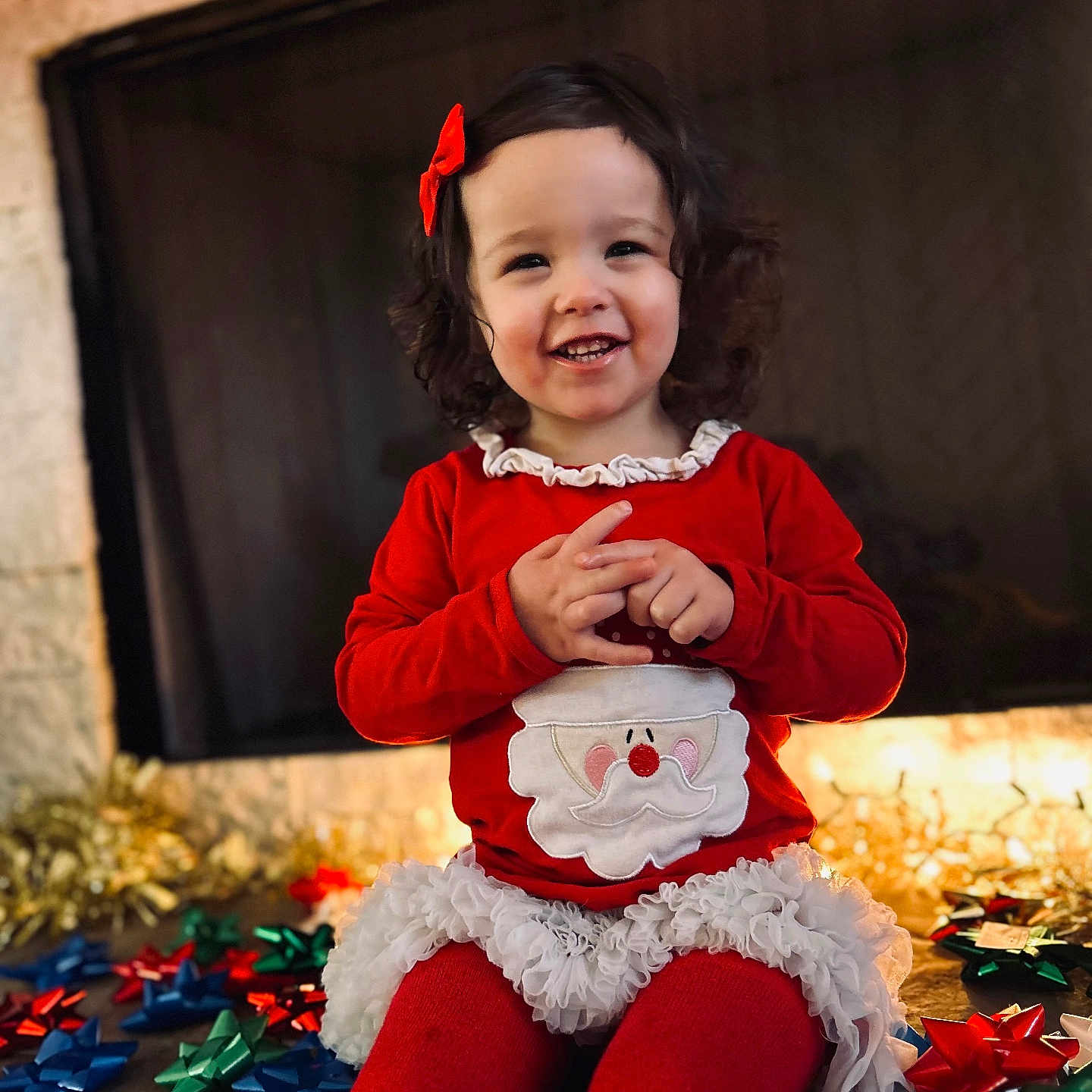 Logan joined the competition — help win amazing prizes! bodypart, child, clothing, costume, face, female, festival, fireplace, flower, girl, happy, head, indoors, pants, person, photography, plant, portrait, sitting, smile