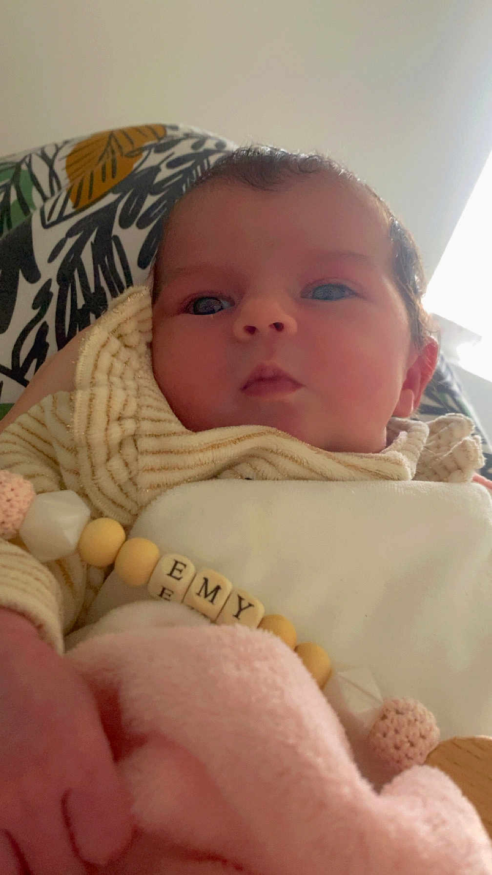 Emy participe au concours pour gagner de l'argent avec cette photo : baby, beads, blanket, child, closeup, clothing, cozy, curious, cute, face, hand, indoor, infant, newborn, pink, portrait, soft, striped, toy, warm