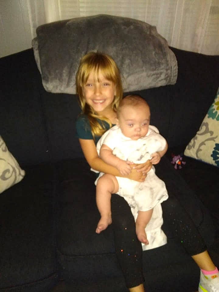 Adrianna joined the competition — help win amazing prizes! arm, baby, child, family, fun, furniture, interaction, iris, joy, lap, leg, person, sitting, skin, toddler, vacation