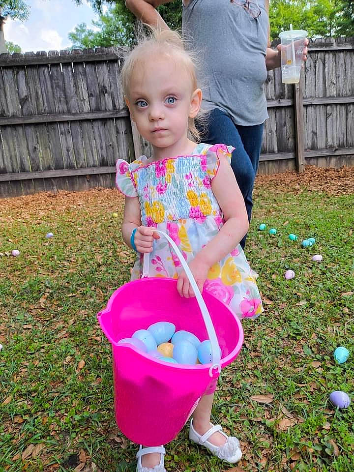 Kira joined the competition — help win amazing prizes! baby_toddler_clothing, child, easter, event, fence, fun, garden, grass, happy, lawn, leisure, magenta, people_in_nature, person, pink, plant, recreation, toddler, toy, tree