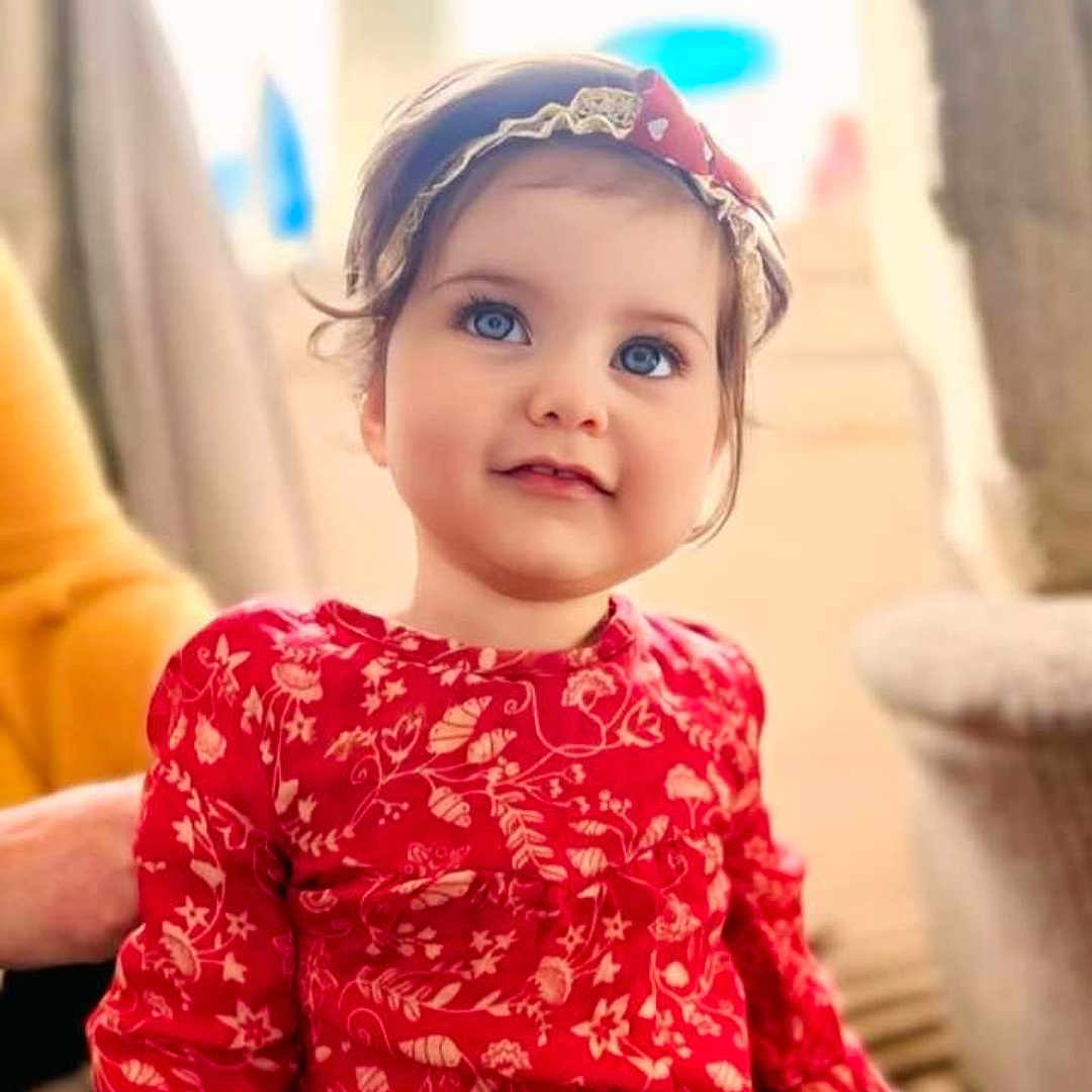 Aaria is registered to the contest to win money with this photo: accessories, baby, babylaughing, bodypart, clothing, dimples, dress, face, hair, happy, hat, head, headband, person, photography, portrait, shoulder, sleeve, smile