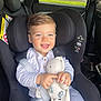 toddler, child, car_seat, stuffed_animal, toy, smiling, happy, blue_eyes, clothing, seatbelt, interior, car, baby, cute, portrait, safety, seat, fabric, infant, young_child