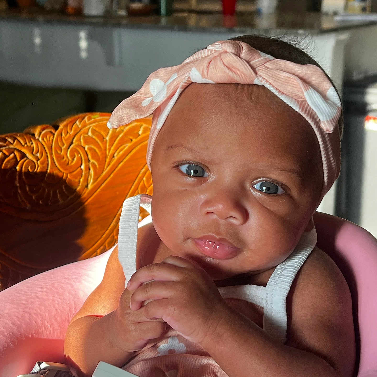 Kahlani joined the competition — help win amazing prizes! accessories, arm, baby, bodypart, bonnet, cap, clothing, couch, cup, face, finger, furniture, hand, hat, head, indoors, person, photography, portrait, sitting