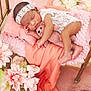 baby, clothing, crib, cushion, dress, face, flower, flowerarrangement, flowerbouquet, furniture, hat, head, homedecor, infantbed, newborn, person, petal, photography, plant, portrait