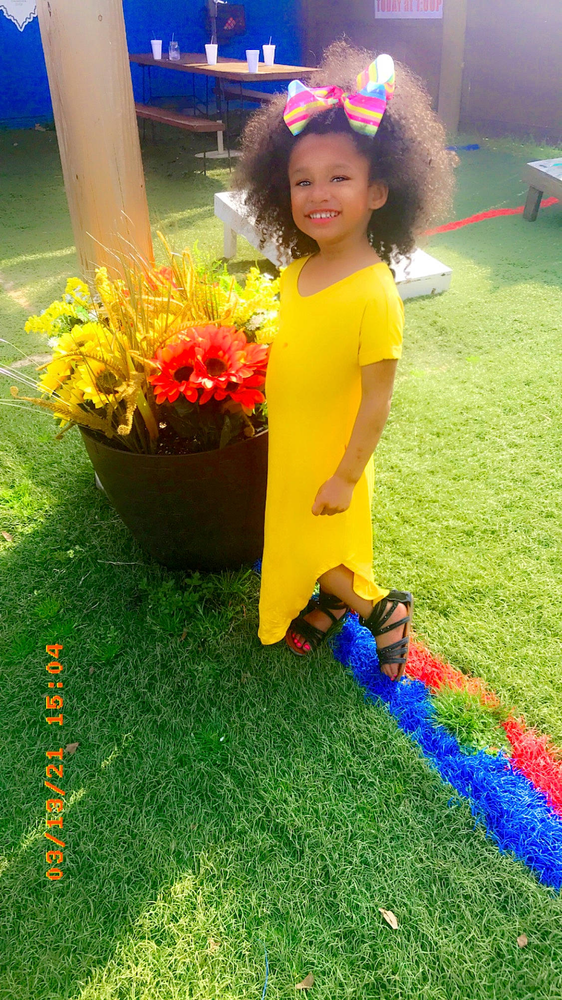 Riley-rose is registered to the contest to win money with this photo: blue, child, event, flower, flowerpot, fun, grass, green, happy, joy, leisure, people_in_nature, person, petal, photograph, plant, red, smile, snapshot, summer
