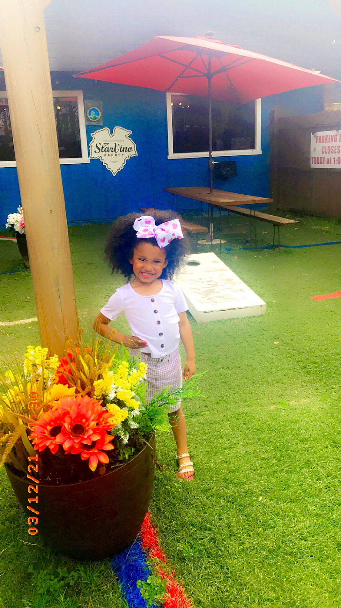 Riley-rose joined the competition — help win amazing prizes! annual_plant, bouquet, cut_flowers, floral_design, floristry, flower, flower_arranging, flowerpot, fun, grass, hat, headwear, joy, leisure, person, petal, plant, red, shorts, smile