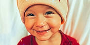 Kaila participe au concours pour gagner de l'argent avec cette photo : toddler, child, smiling, hat, winter_hat, red_sweater, holiday_lights, festive, cute, face, portrait, indoors, warm_clothing, cheerful, happy, baby, christmas, seasonal, closeup, cozy