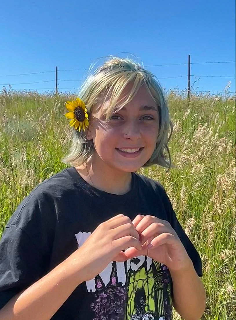 Danielle is registered to the contest to win money with this photo: blond, brown_hair, ecoregion, field, flower, fun, grass, grass_family, grassland, happy, joy, meadow, natural_environment, people_in_nature, person, plant, prairie, sky, sleeve, smile