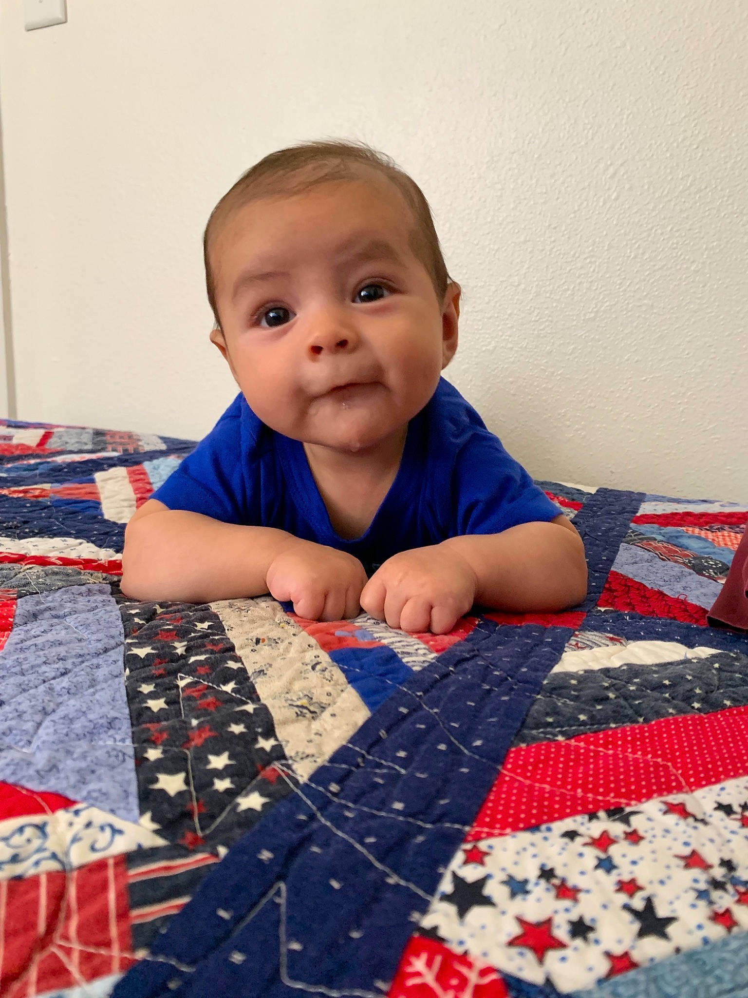 Kaeden is registered to the contest to win money with this photo: art, baby, bedding, blanket, cheek, child, craft, face, floor, head, linens, pajamas, patchwork, pattern, person, play, quilt, quilting, textile, toddler
