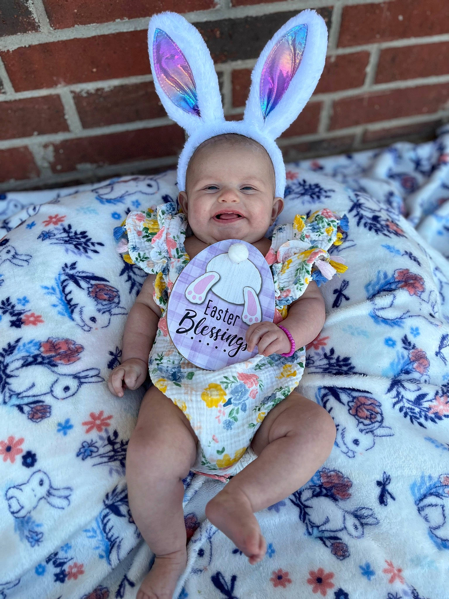 Emerie is registered to the contest to win money with this photo: baby, baby_toddler_clothing, ear, easter_bunny, eye, fawn, grass, happy, hare, head, leg, pattern, person, pink, purple, rabbit, rabbits_and_hares, skin, sleeve, textile