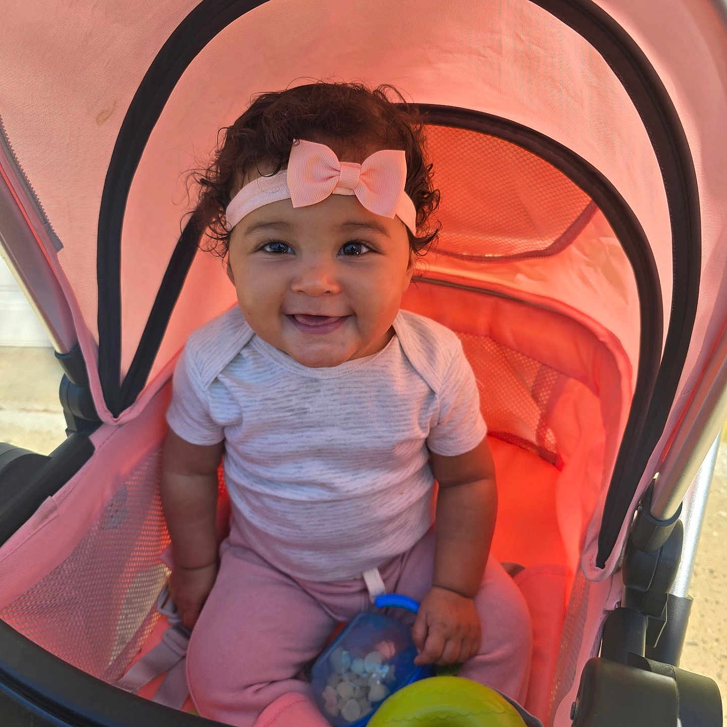 Alannah Joy is registered to the contest to win money with this photo: accessories, baby, clothing, crib, face, furniture, glasses, happy, hat, head, infantbed, outdoors, person, photography, portrait, smile, stroller, sunglasses, t_shirt, tape
