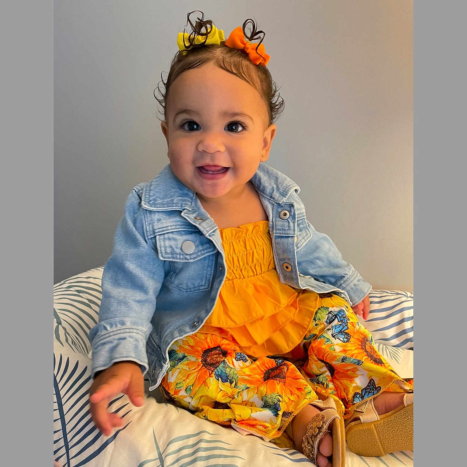 Mila is registered to the contest to win money with this photo: accessories, baby, clothing, coat, couch, cushion, dress, face, furniture, happy, head, homedecor, jacket, jeans, pants, person, photography, portrait, sitting, smile
