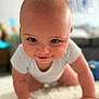 Rowen joined the competition — help win amazing prizes! baby, crawling, white_clothing, carpet, indoor, child, smile, face, hands, head, skin, person, cheeky, happy, young_child, closeup, curious, infant, home, blurred_background