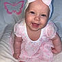 Lylah joined the competition — help win amazing prizes! baby, infant, child, smiling, bow, headband, pink_dress, floral_pattern, blanket, butterfly, chubby_cheeks, open_mouth, tooth, portrait, sitting, indoor, flash, plush, cute, happy