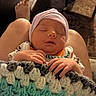 Christopher joined the competition — help win amazing prizes! newborn, baby, sleeping, blanket, crocheted_blanket, hand, lap, indoors, living_room, foot, furniture, leather_couch, chair, cozy, peaceful, child, headwear, knitwear, person, home