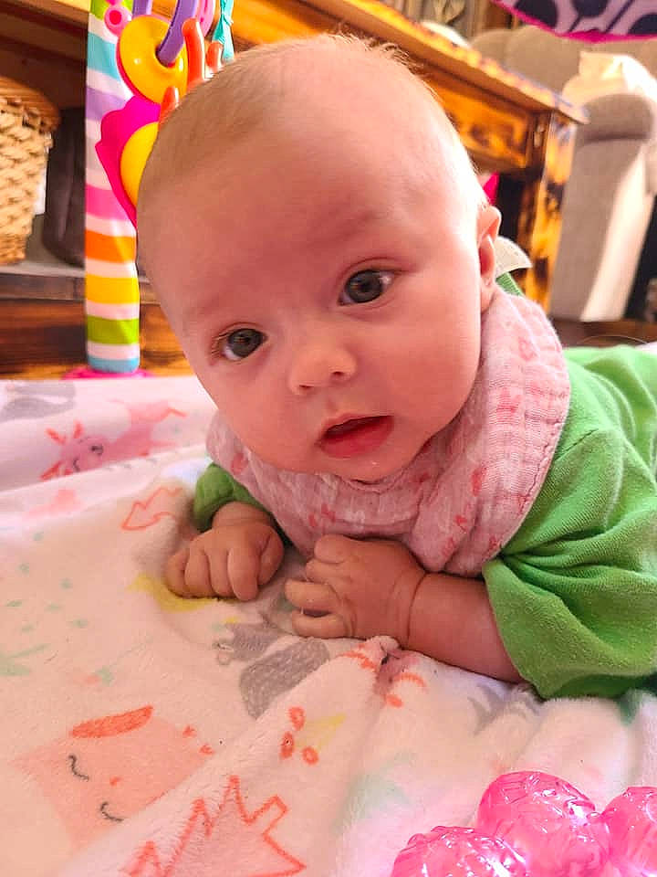 Kenzlee is registered to the contest to win money with this photo: baby, baby_toddler_clothing, cheek, eye, face, facial_expression, fun, happy, head, human, human_body, iris, lip, mouth, nose, person, pink, product, skin, textile