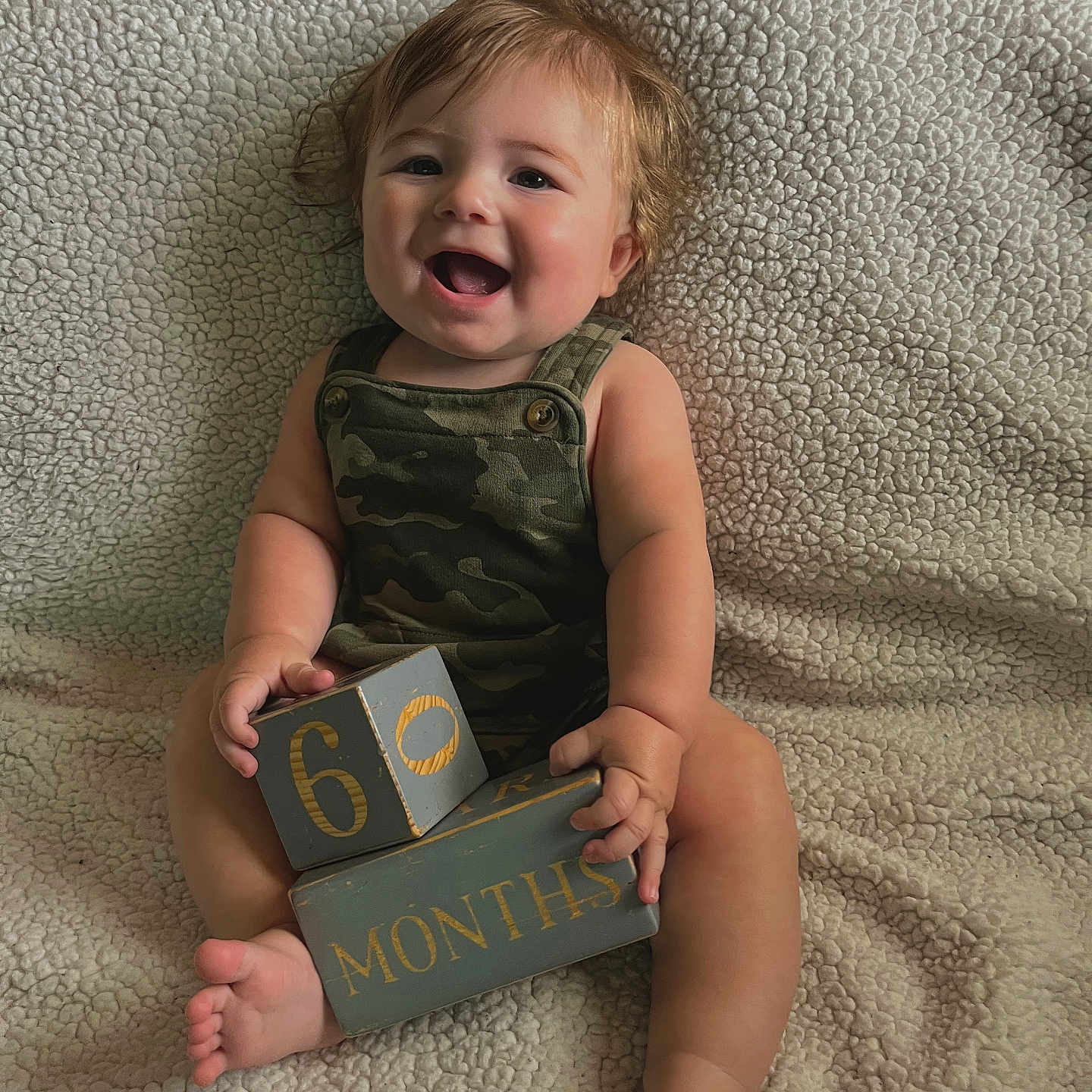 Nolan joined the competition — help win amazing prizes! baby, bodypart, clothing, couch, creditcard, cushion, face, finger, furniture, hand, happy, head, homedecor, indoors, person, photography, portrait, sitting, t_shirt, text