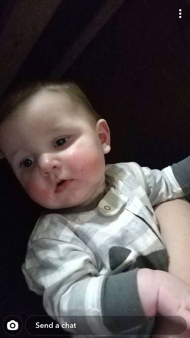 Magnolia is registered to the contest to win money with this photo: baby, baby_toddler_clothing, cheek, comfort, ear, eye, eyebrow, finger, flash_photography, forehead, gesture, human_body, iris, jaw, lip, mouth, neck, nose, person, sleeve