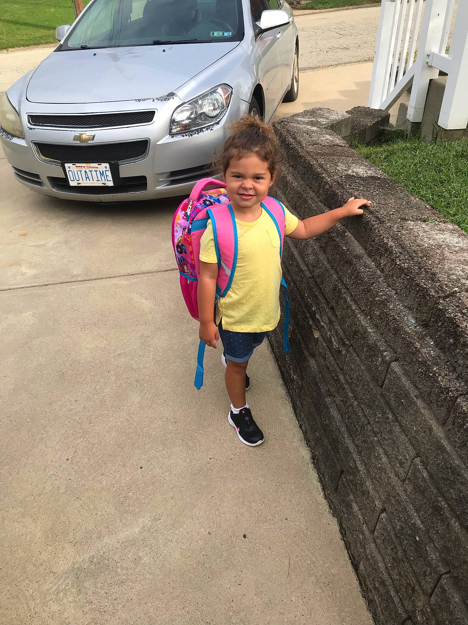 Ruby is registered to the contest to win money with this photo: asphalt, automotive_design, automotive_exterior, automotive_fog_light, automotive_lighting, automotive_tire, bumper, car, grille, headlamp, hood, joy, motor_vehicle, person, road, shorts, tire, vehicle, vehicle_door, vehicle_registration_plate