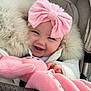 baby, child, smile, pink_bow, plush_toy, stroller, coat, fur_trim, happy, cute, infant, clothing, portrait, hand, soft_toy, warm, headwear, closeup, person, baby_accessory