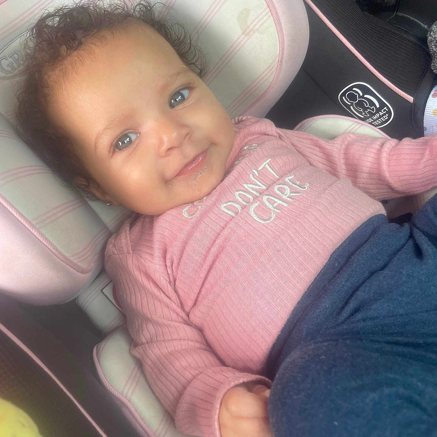 Zaila Stilwell joined the competition — help win amazing prizes! baby, bodypart, clothing, coat, cushion, face, happy, head, homedecor, jacket, knitwear, laughing, pants, person, photography, portrait, sitting, smile, sweater, t_shirt