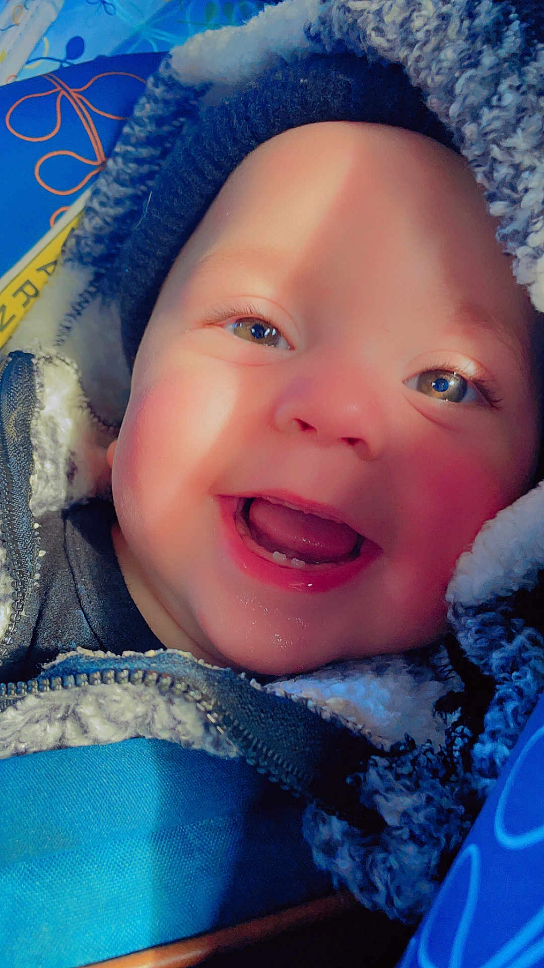 Noah joined the competition — help win amazing prizes! baby, child, face, smile, teeth, winter_clothing, hat, jacket, zipper, blue, cozy, happy, closeup, infant, portrait, warm, cute, outdoor, skin, eyelashes