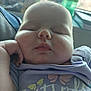 baby, sleeping, face, hand, purple_shirt, butterfly, chubby_cheeks, infant, closeup, peaceful, cute, child, young, portrait, relaxed, indoors, soft_light, person, apparel, resting