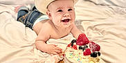 Banks joined the competition — help win amazing prizes! baby, berries, blanket, cake, celebration, child, cowboy_hat, cream, cute, dessert, dirt_on_face, food, happy, indoor, jeans, messy, playful, portrait, sitting, smiling