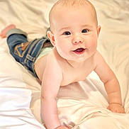 Banks joined the competition — help win amazing prizes! baby, child, crawling, denim_pants, smiling, happy, face, skin, arm, hand, bed, blanket, soft, indoors, cute, infant, person, head, eyes, cheeks