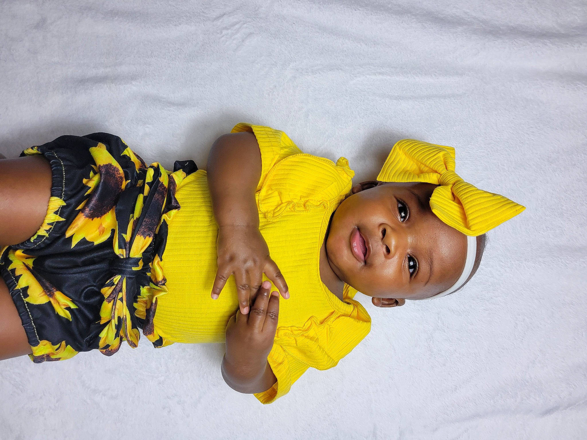 Nandi is registered to the contest to win money with this photo: baby, baby_laughing, baby_products, baby_toddler_clothing, bedtime, child, comfort, fashion_accessory, fun, happy, headgear, linens, person, play, sleeve, smile, t_shirt, textile, thigh, toddler