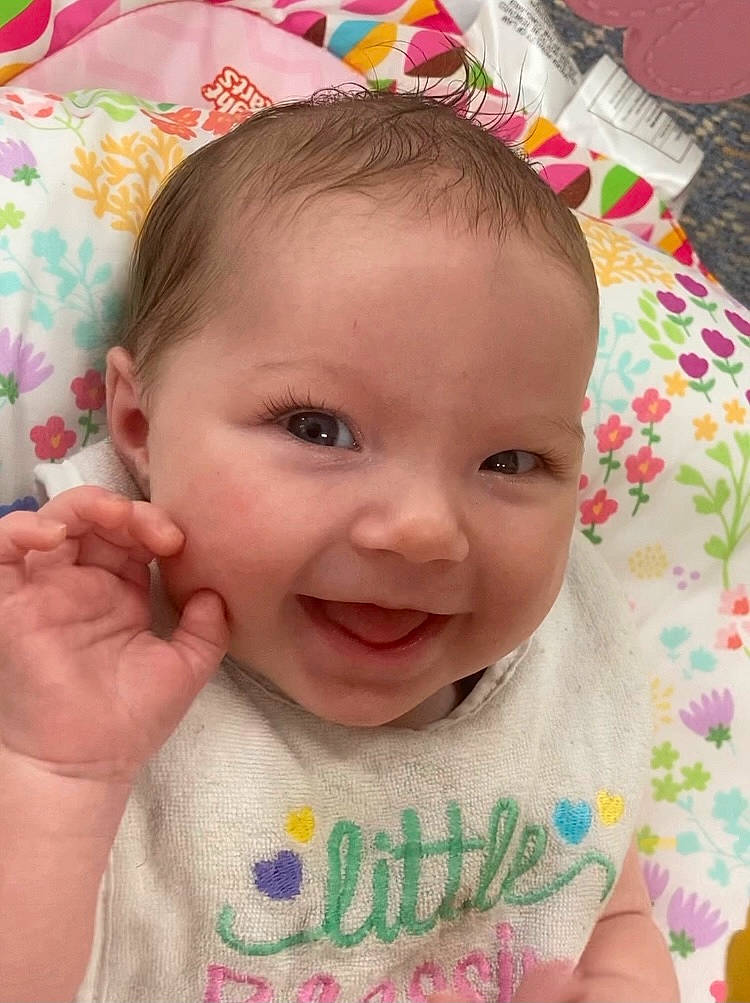 Oaklynn is registered to the contest to win money with this photo: baby, cheek, chin, eye, eyebrow, eyelash, face, facial_expression, forehead, green, hairstyle, head, human, lip, mouth, nose, organ, person, product, skin